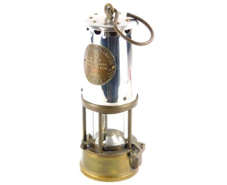 A Protector miner's lamp type 6, in polished steel and brass, 23cm high.