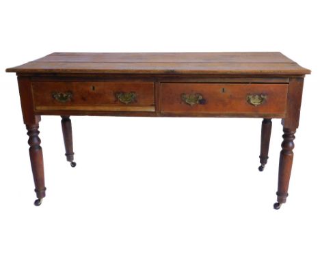 A Victorian pine diary type table, the plank top above two frieze drawers on turned legs with ceramic castors, 82cm high, 153