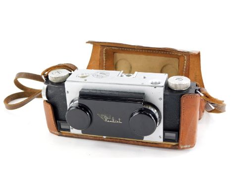 A Realist stereo twin lens camera, in a leather case.