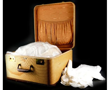 An Everleigh vintage suitcase, and a large quantity of linen, etc.
