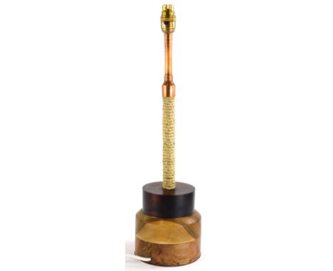 A modern industrial style table lamp, with copper and rope column, the base turned in three different woods, to include elm, 