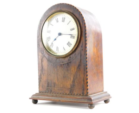 An Edwardian oak and chequer banded mantel clock, in a domed case with white enamel dial, on ball feet, 21cm high.