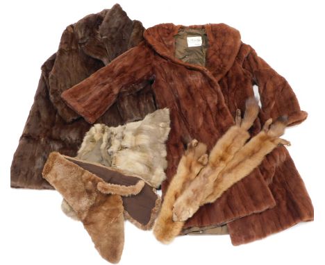 A brown vintage fur coat with label for L Marks Furrier Wolverhampton, another retailed by the same furrier, etc.
