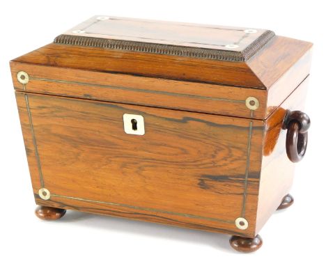 A Victorian rosewood pewter and mother of pearl inlaid sarcophagus shaped tea caddy, the hinged lid enclosing two lidded divi