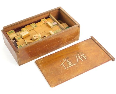A Mahjong game, in hardwood box with sliding lid.