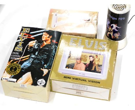 A collection of Elvis Presley memorabilia, to include a lamp (boxed), Leonardo figures (boxed), etc. 