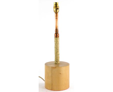 A modern industrial style table lamp, with copper and rope column, and turned beech base, 48cm high. 