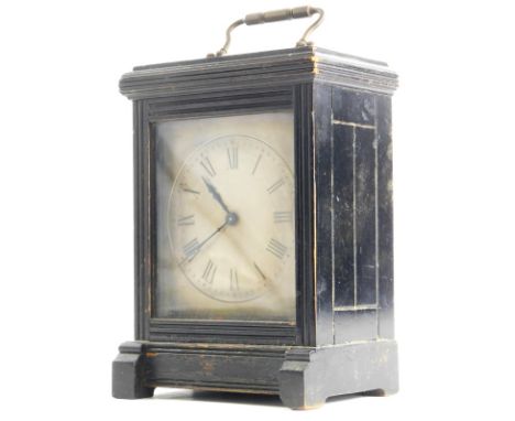 A Victorian Aesthetic movement carriage clock, with an ebonised case, the silvered dial decorated with Roman numerals, brass 