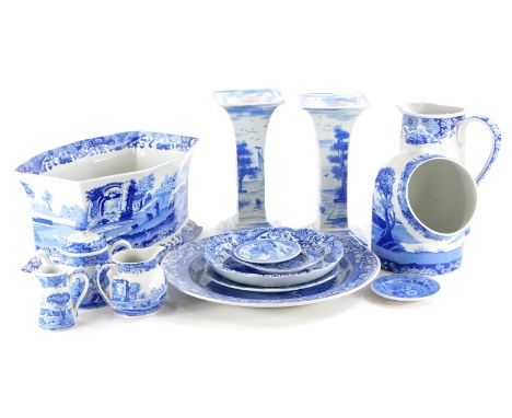 A quantity of blue and white pottery, to include a pair of Spode candle stands, Spode Italian wall jug, jardiniere, salt cont