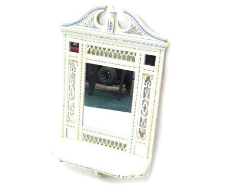 A late 19th/ early 20thC wall mirror, later painted in cream, with flowers, etc., with pierced borders surrounded a rectangul