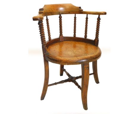 A 19thC ash and elm captains type chair, with bobbin turned support, solid feet and splayed legs. Note: VAT is payable on the