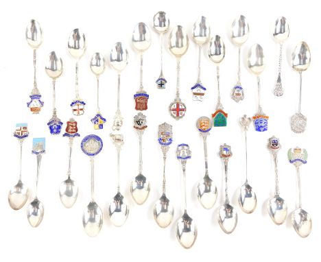 A quantity of silver and enamel souvenir spoons, all bearing hallmarks, 11¾oz gross.