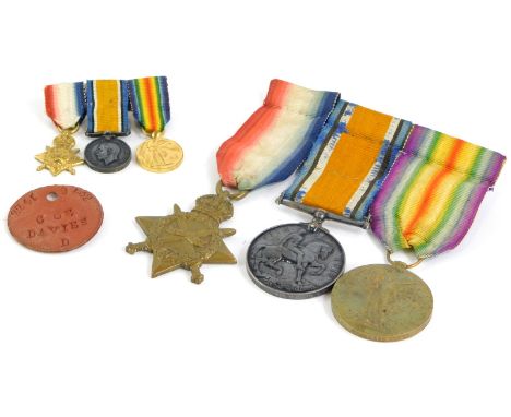 A First World War trio of medals, awarded to a 298 Staff Sergeant John Howard Davies, the Army Service Corp with miniatures a