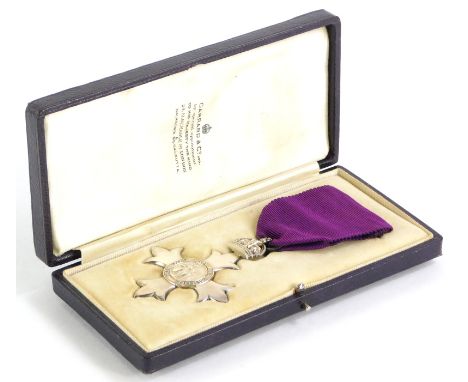 A silver early 20thC silver M.B.E, London 1917, issued in a Garrard and Co. fitted case, with purple ribbon, believed to be o