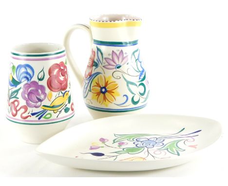 A quantity of Poole pottery, to include a vase decorated with flowers, birds in typical manner, 15cm high, similar jug, 18cm 