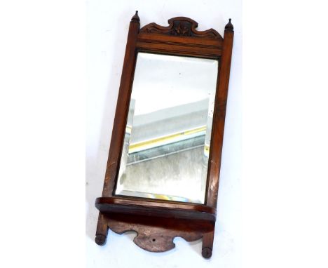 A late 19thC walnut rectangular wall mirror, with shelf, 65cm high, 28cm wide.