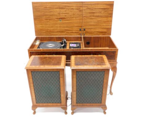 A Dynatron radiogram, with Garrard SP25 Mark IV record deck, and two speakers, in a walnut case, on cabriole legs, 97cm wide.