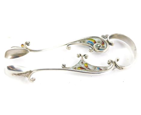 A pair of Marius Hammer silver and plique a jour enamel sugar tongs, decorated with a design of scrolls, etc., in turquoise, 