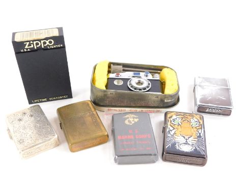 A quantity of novelty and other lighters, to include Zippo, US Marine Corp lighter, another silver plated inset with red and 