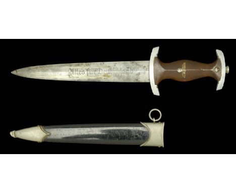 A German Second World War S.A. Dagger. An NSKK dagger, heavily stained blade, RZM M79 with the remaining letters obscured by 