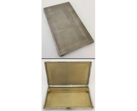 A solid silver cigarette case. Hallmarked Birmingham 1948. Monogram C.D to front. Approx. weight 230.4g 