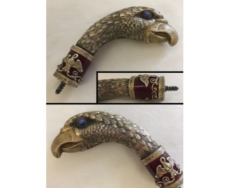 A House of Fabergé silver gilt walking cane handle in the shape of an eagle's head. Set with Star Sapphires for eyes, and rub