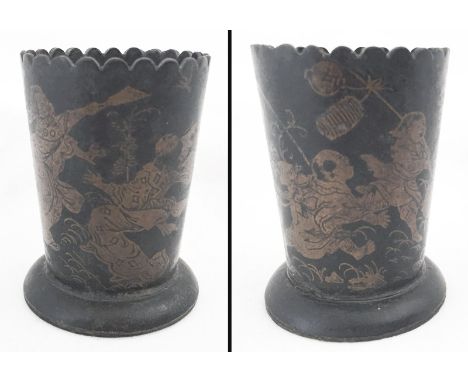 A Chinese papier mâché cup with gilt painted decoration of children playing.  Approx. 7cm tall.