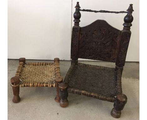 A vintage Afghan Tribal wicker seat with carved back. Together with a tribal stool. 