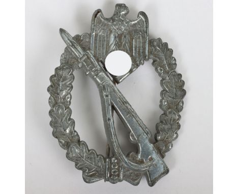WW2 German Army / Heer Infantry assault badge in silver by M.K.1, Gablonz manufacturing. Zinc construction with crimped in se