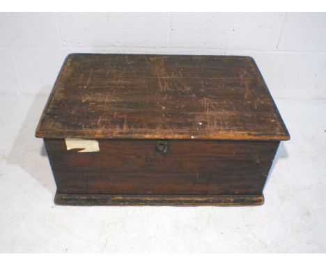 A small pine trunk, length 68cm, depth 44cm, height 30cm.