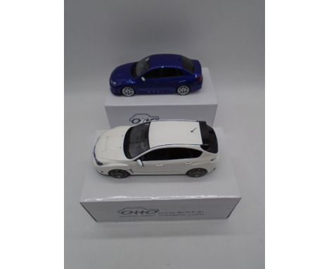 Two boxed Otto Mobile die-cast car models of Subaru's including the Impreza R205 2010 (White) &amp; STI 206 (Blue) - Scale 1: