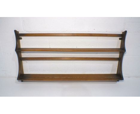 An Ercol 'Golden Dawn' plate rack.