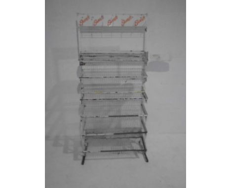 A vintage retail confectionary display stand. Brands and pricing still visible include Mars, Marathon, Bounty, Topic, Opal Fr