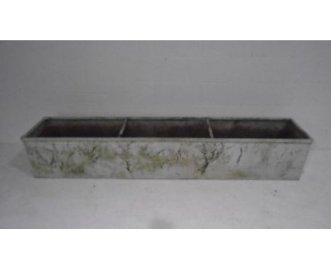 A large galvanised trough. 244cm x 49cm 