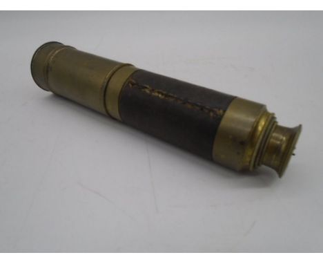 A vintage three drawer brass telescope