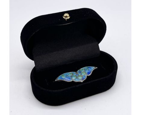 A turn of the century SCM and enamel brooch in the Liberty style