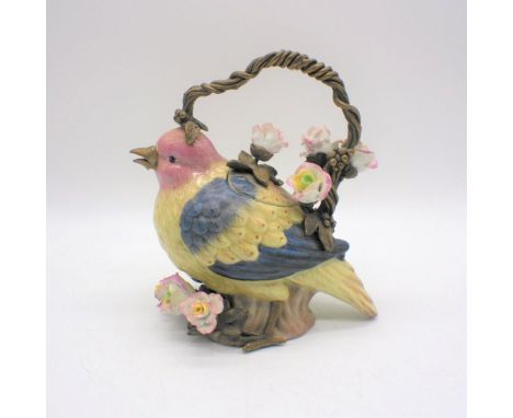 A ceramic teapot in the form of a bird - some repair to beak.