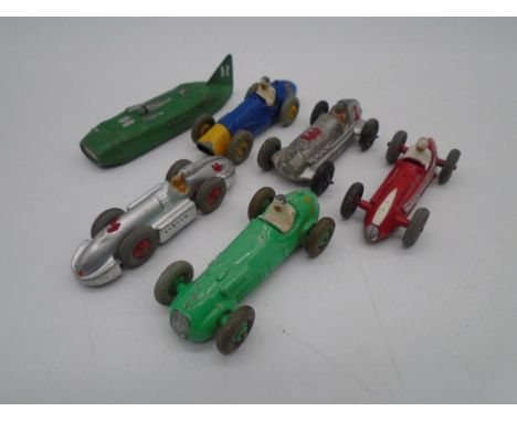 A collection of five unboxed vintage Dinky Toys die-cast racing cars including Masserati (No 231), Ferrari (23H), H.W.M (No 2