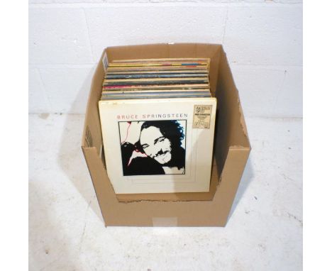 A quantity of 12" vinyl records including The Who, Bruce Springsteen, Wishbone Ash, Bob Dylan, Free, Neil Young, Dire Straits