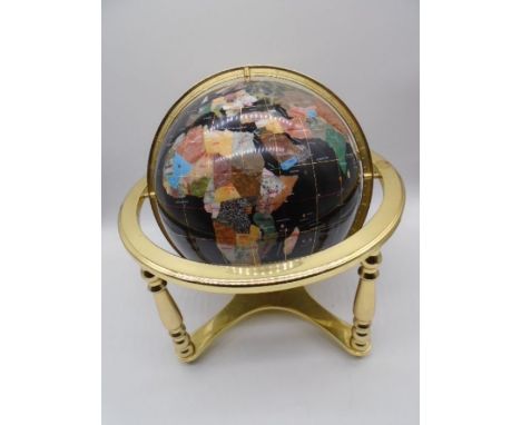 A gemstone globe with brass supports and compass under - height approx. 45cm 