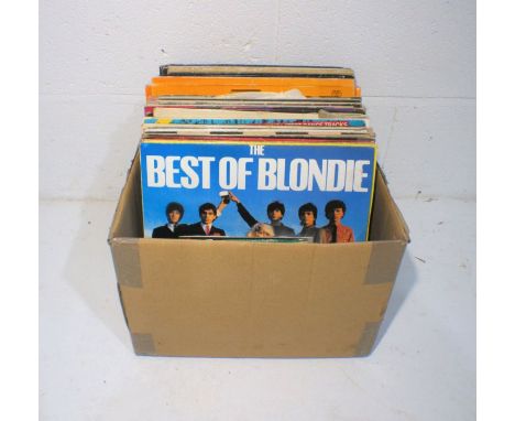 A quantity of 12" and 7" vinyl records including UB40, Madness, Blondie, The B52s, The Rolling Stones, 10cc, Depeche Mode, Ji