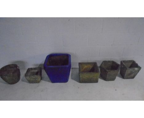 A selection of reconstituted stone planters plus a large blue glazed planter.