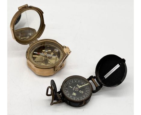 A vintage Stanley brass compass along with another marked Japan