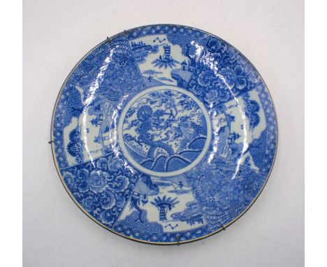 A blue and white ceramic Japanese charger.