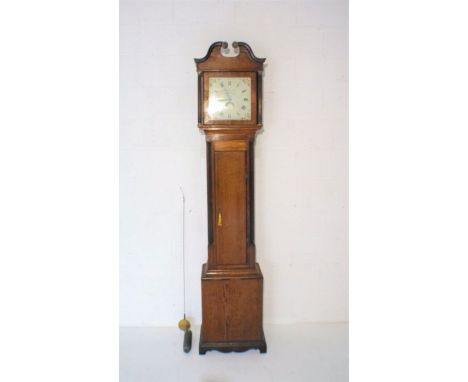 An oak longcase clock with painted dial named to 'W. Gunnell, Newbury'.