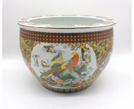 An Oriental ceramic fish bowl with character marks, diameter 42cm, height 29cm.