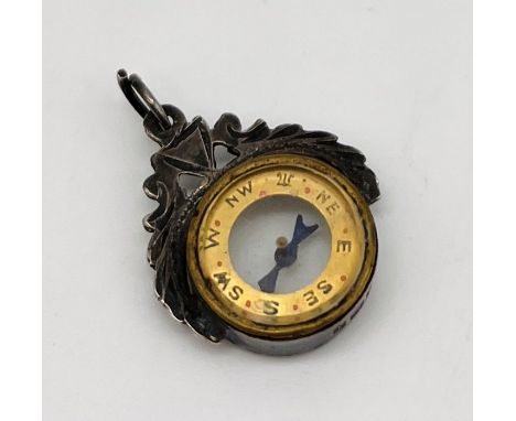 A hallmarked silver miniature compass 