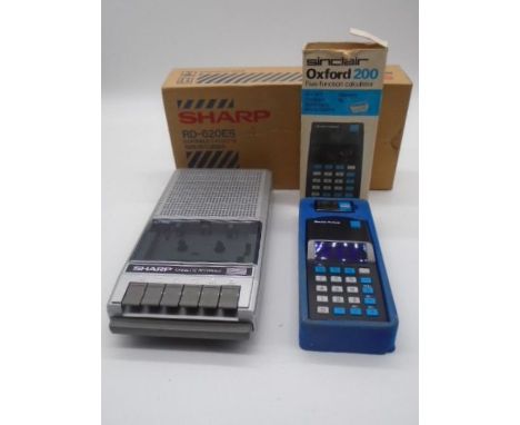 A boxed vintage Sharp portable cassette recorder and a boxed vintage Sinclair Oxford 200 five function calculator.