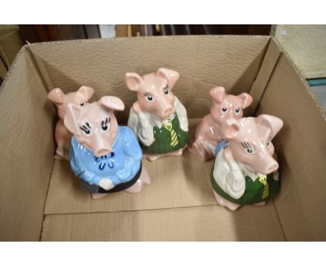 A family of 20th century Wade ceramic Nat West piggy banks