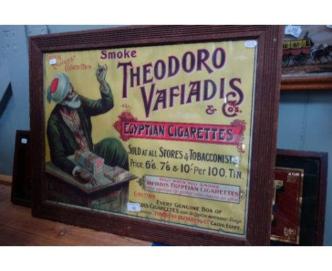 A FRAMED VINTAGE CHROMOLITHOGRAPHIC ADVERTISEMENT "Smoke Theodoro Vafiadis &amp; Co's Egyptian Cigarettes"